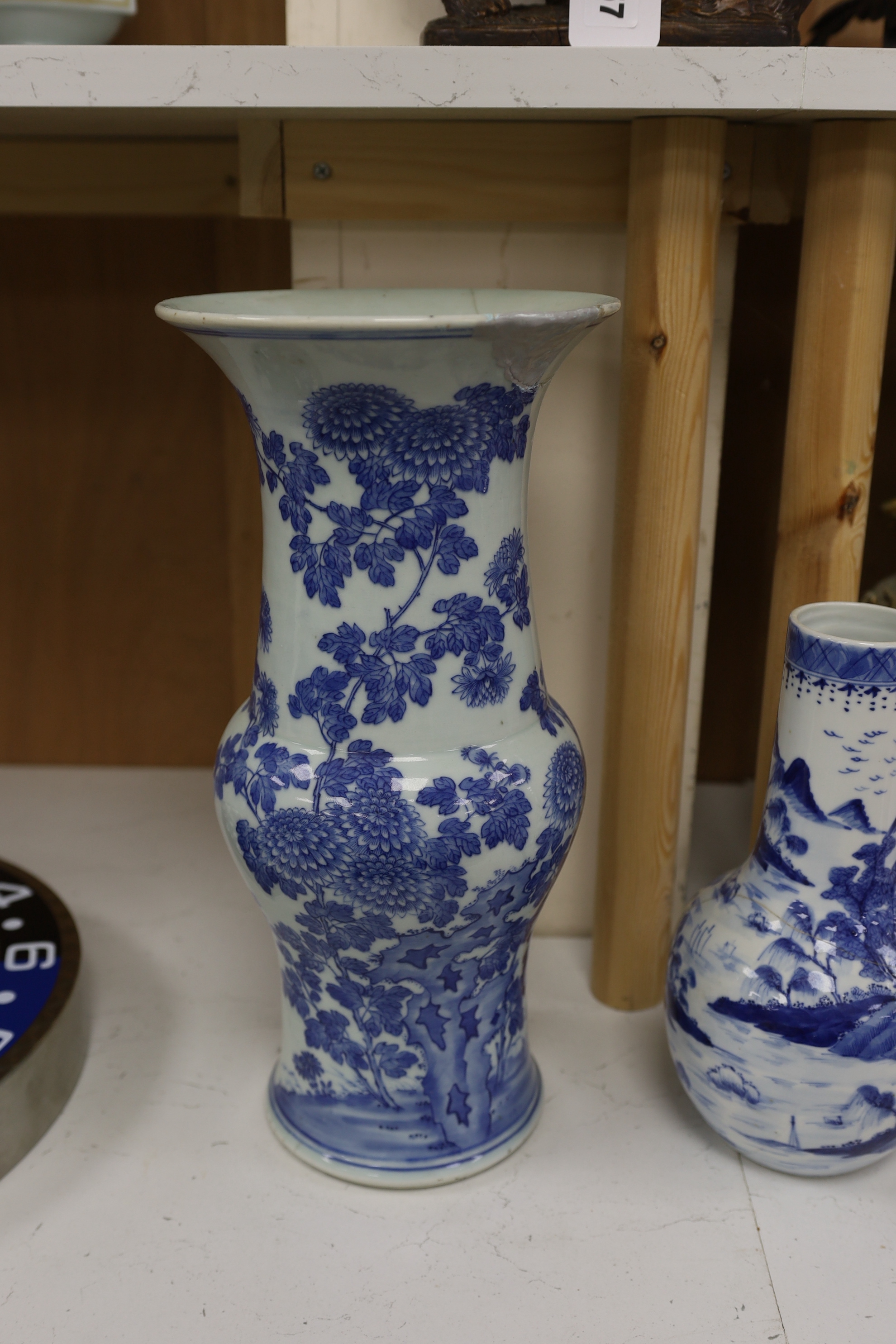 A pair of Chinese Canton decorated famille rose enamelled vases, 36cm high